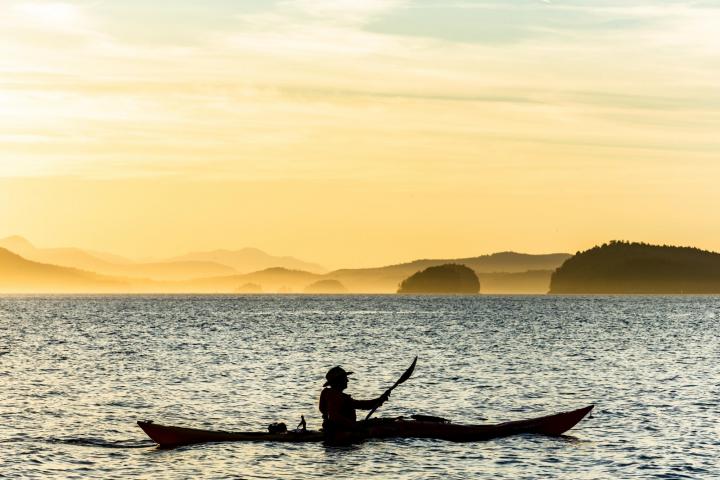 Kayak silhouette, sunset kayak tour, Pender Island Kayak Adventures.