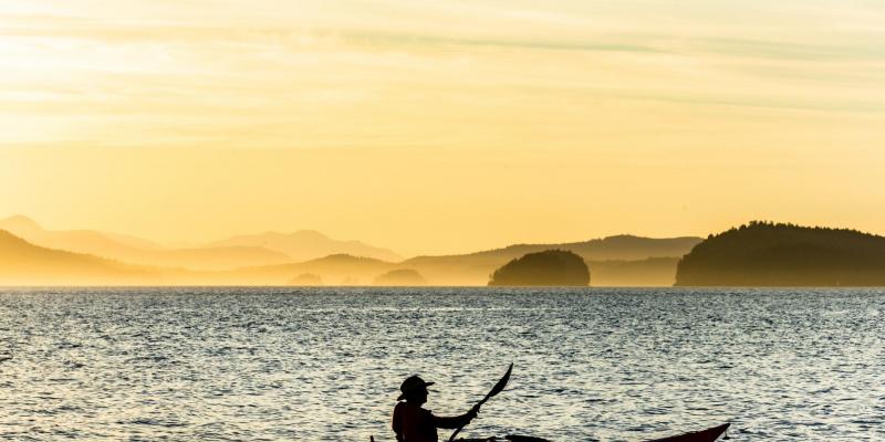 Kayak silhouette, sunset kayak tour, Pender Island Kayak Adventures.